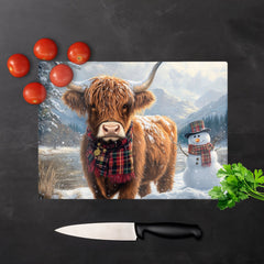 Highland Cow And A Snowman Chopping Board